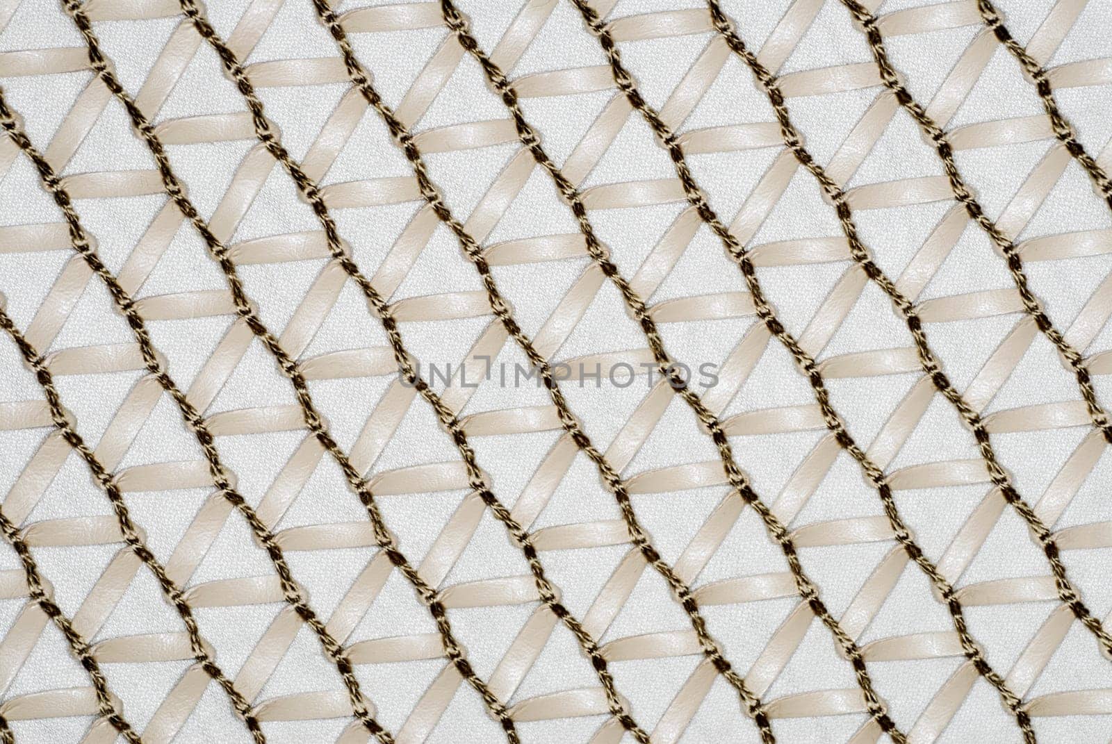 Close-up of a sheet decorated with thread and ribbon