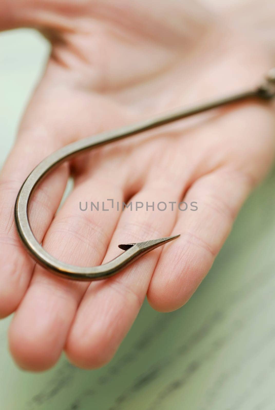 Close-up of a hook on a human palm