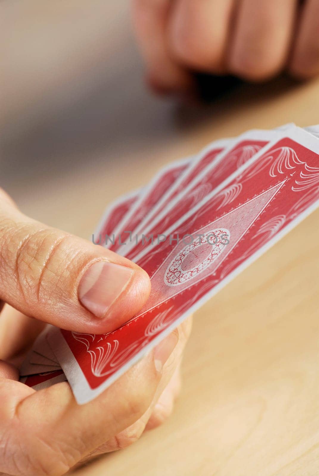 Close-up of a personŽs hand holding playing cards