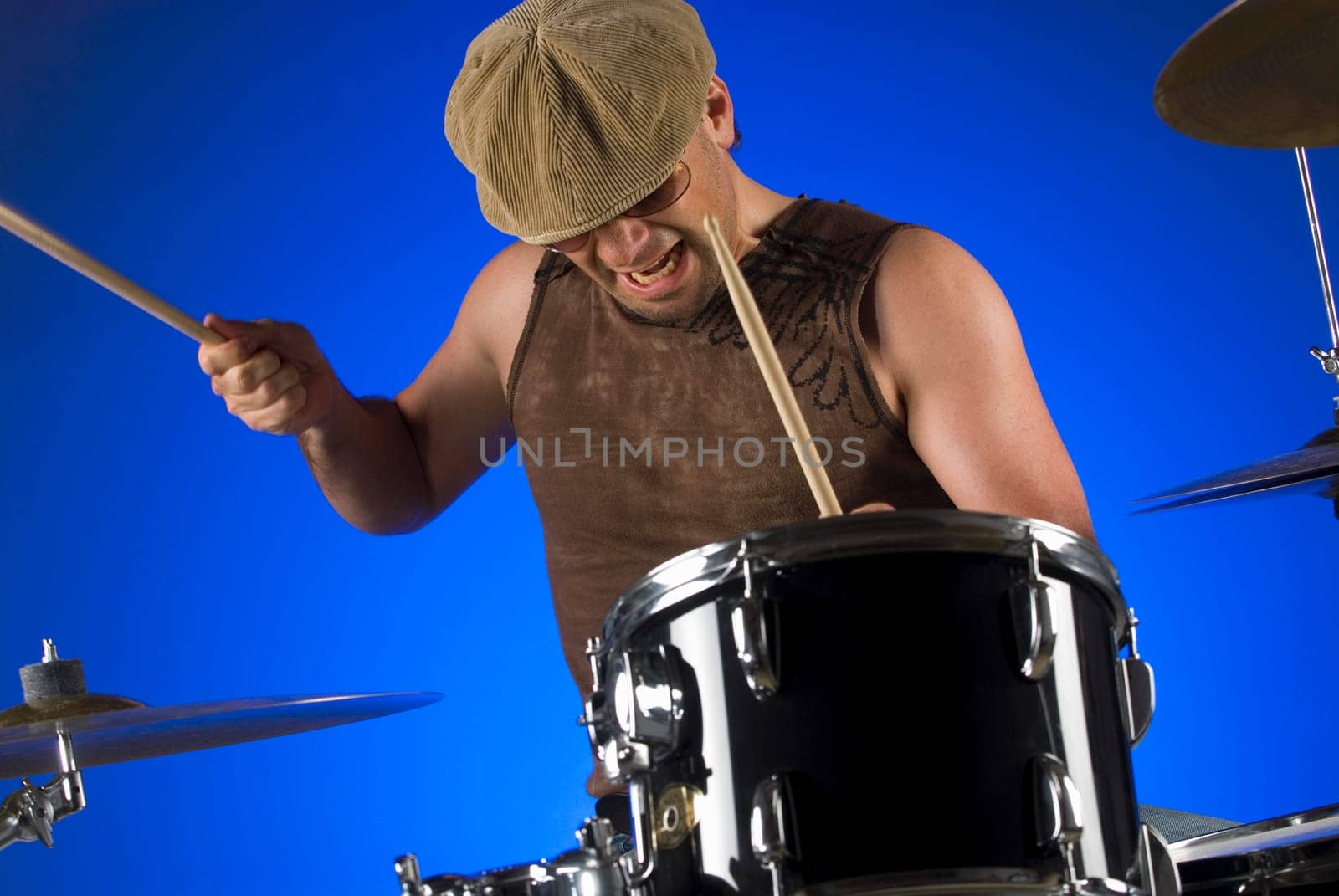 Male drummer playing drums