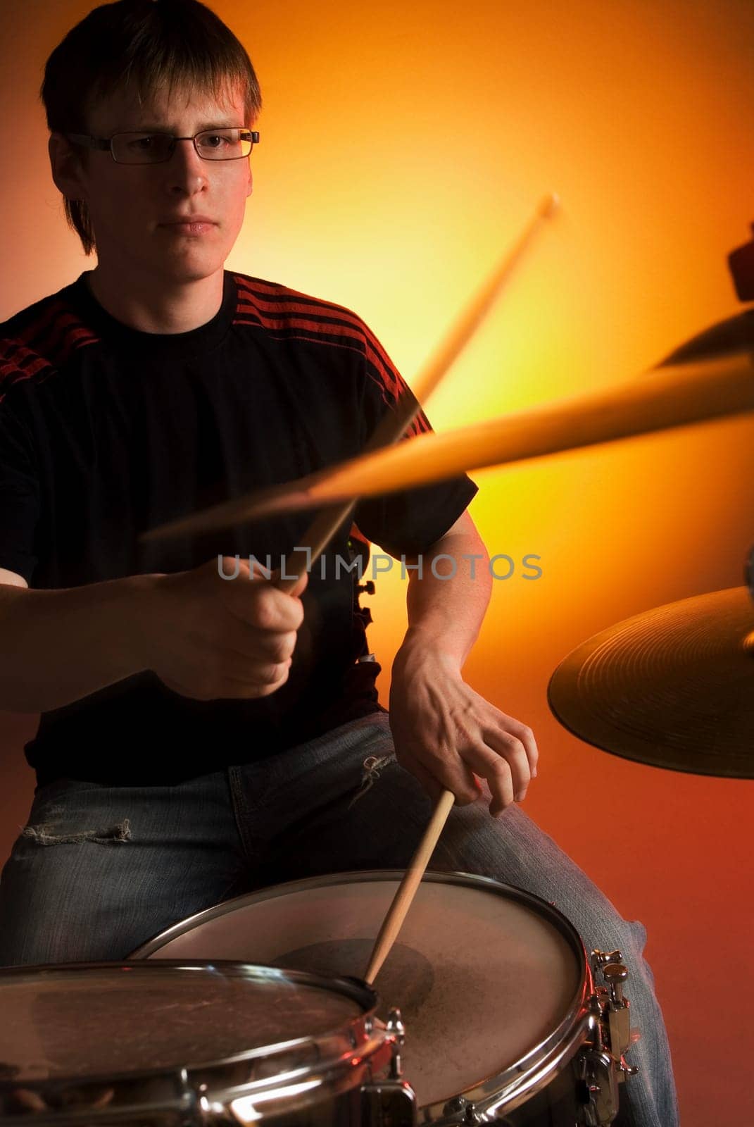Male drummer playing drums