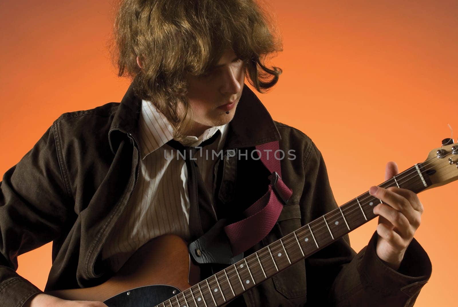 Close-up of a guitarist playing a guitar
