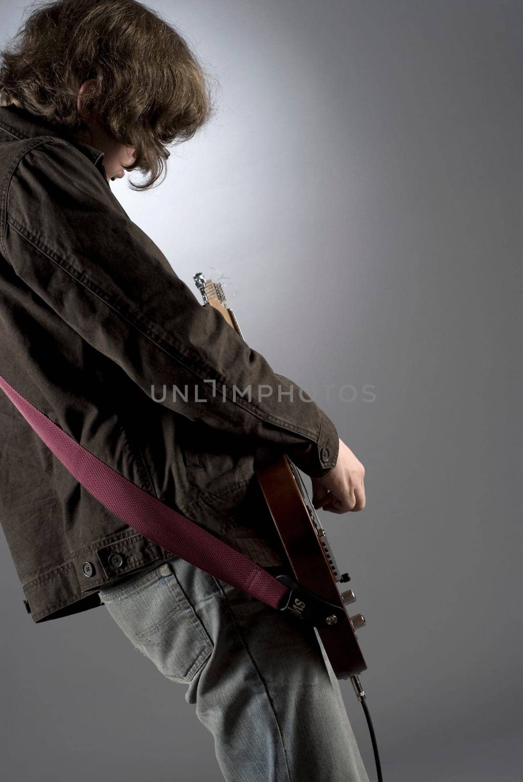 Close-up of a guitarist playing a guitar