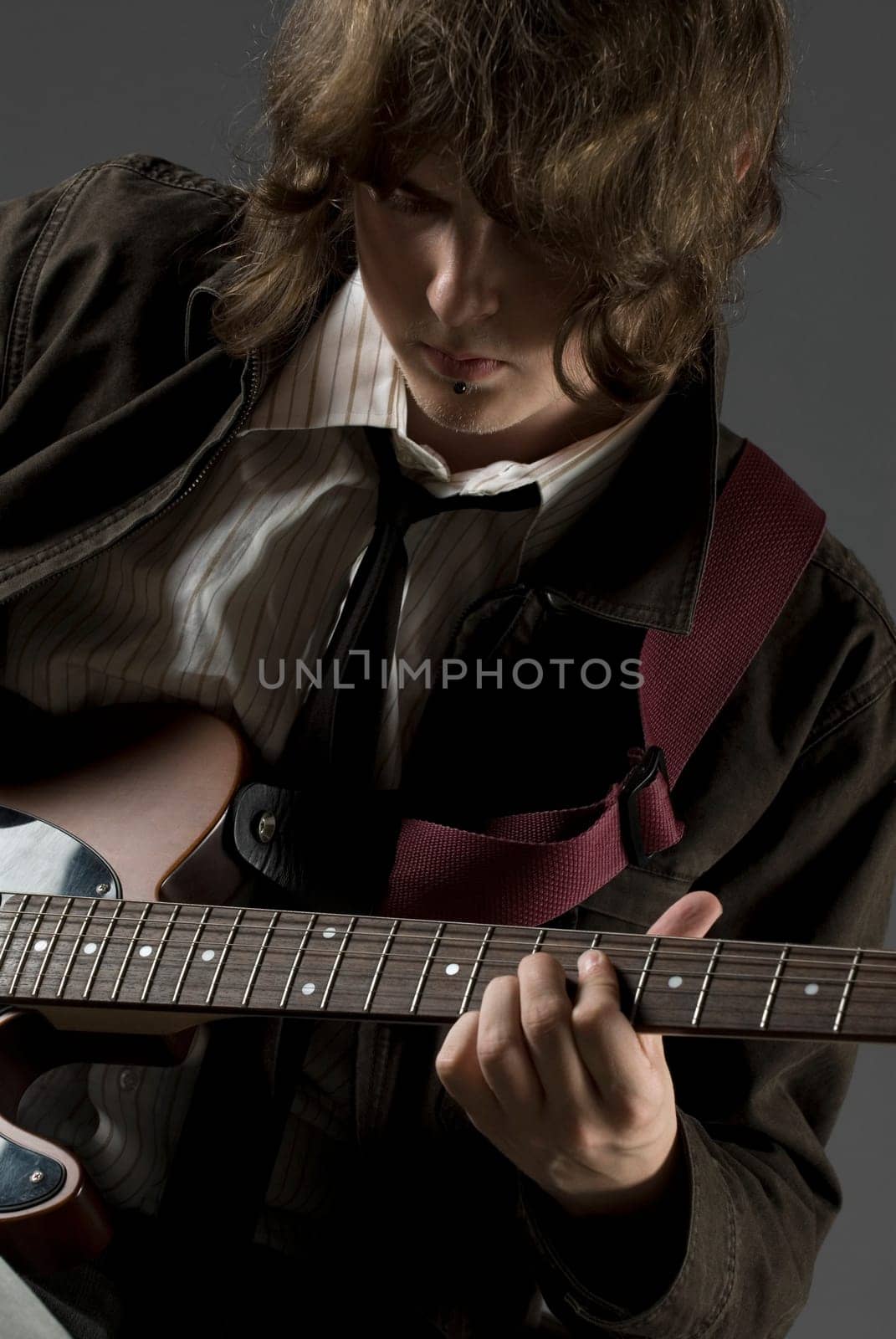 Close-up of a guitarist playing a guitar