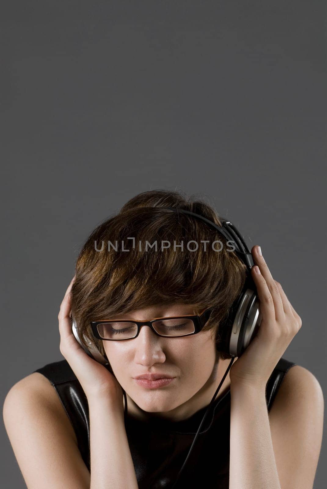 Close-up of a young woman listening to music