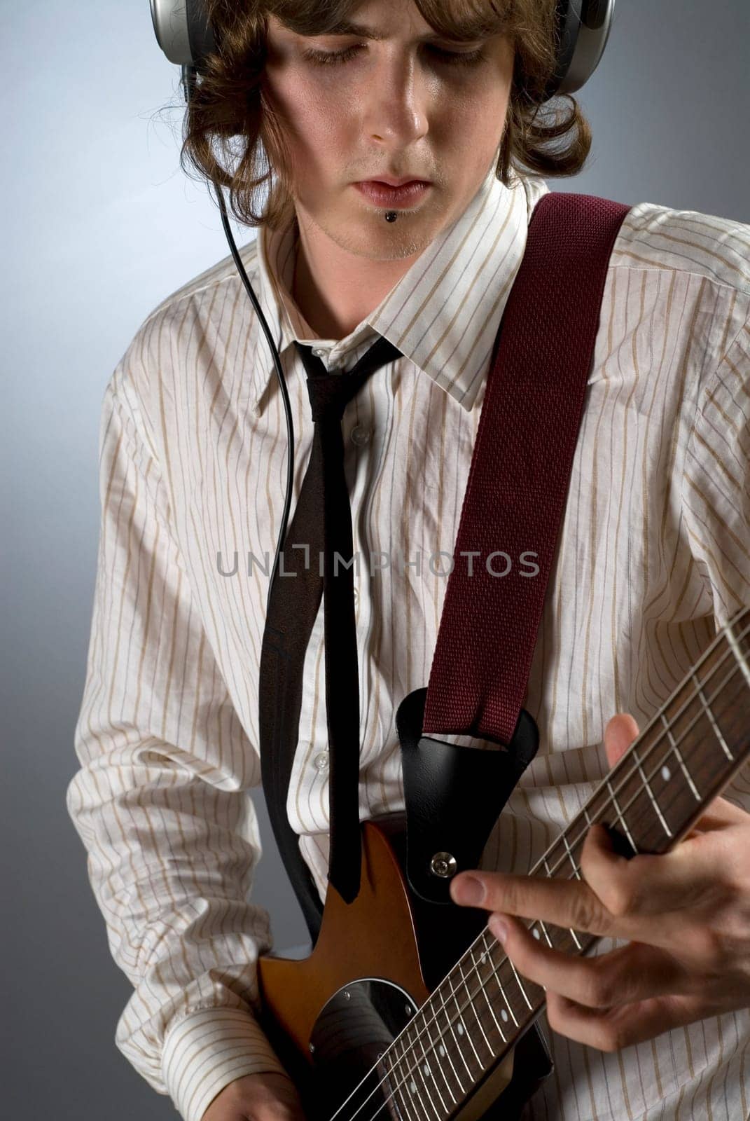 Close-up of a guitarist playing a guitar