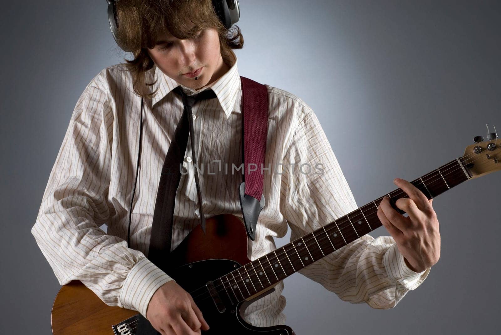 Close-up of a guitarist playing a guitar