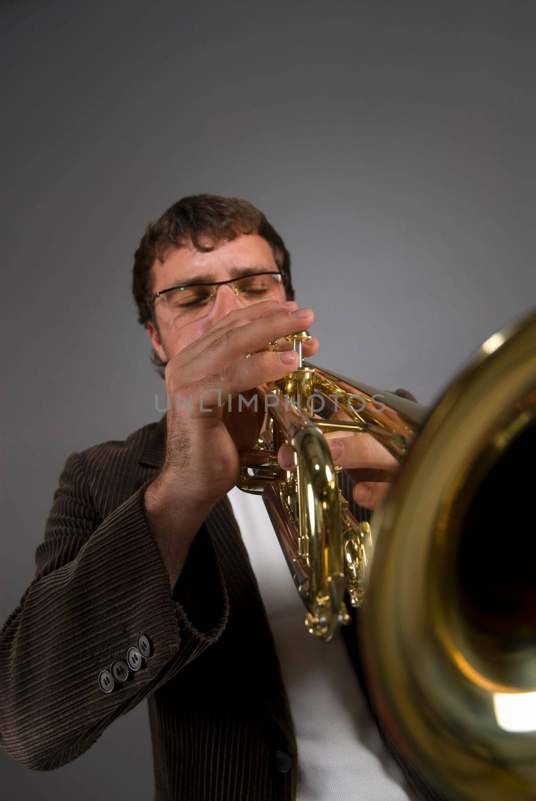 Male musician playing a trumpet