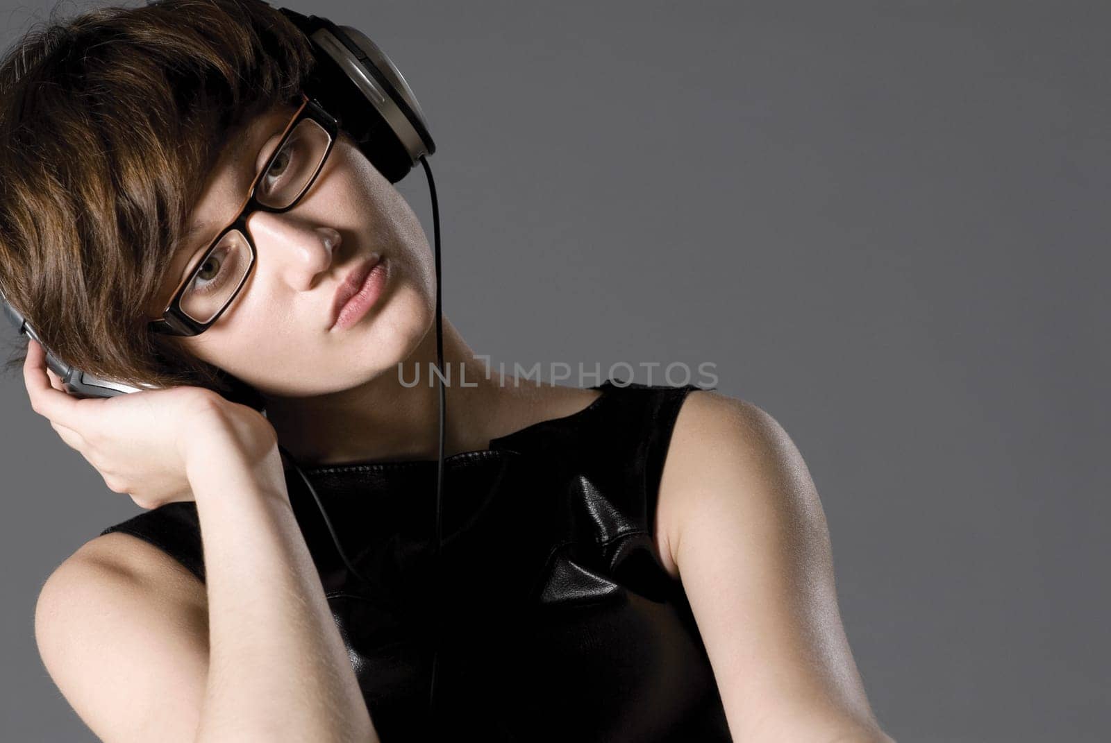 Close-up of a young woman listening to music