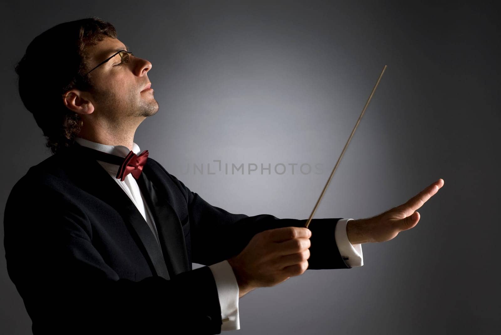 Close-up of a music conductor performing