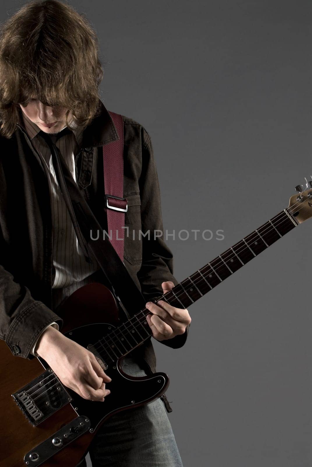 Close-up of a guitarist playing a guitar