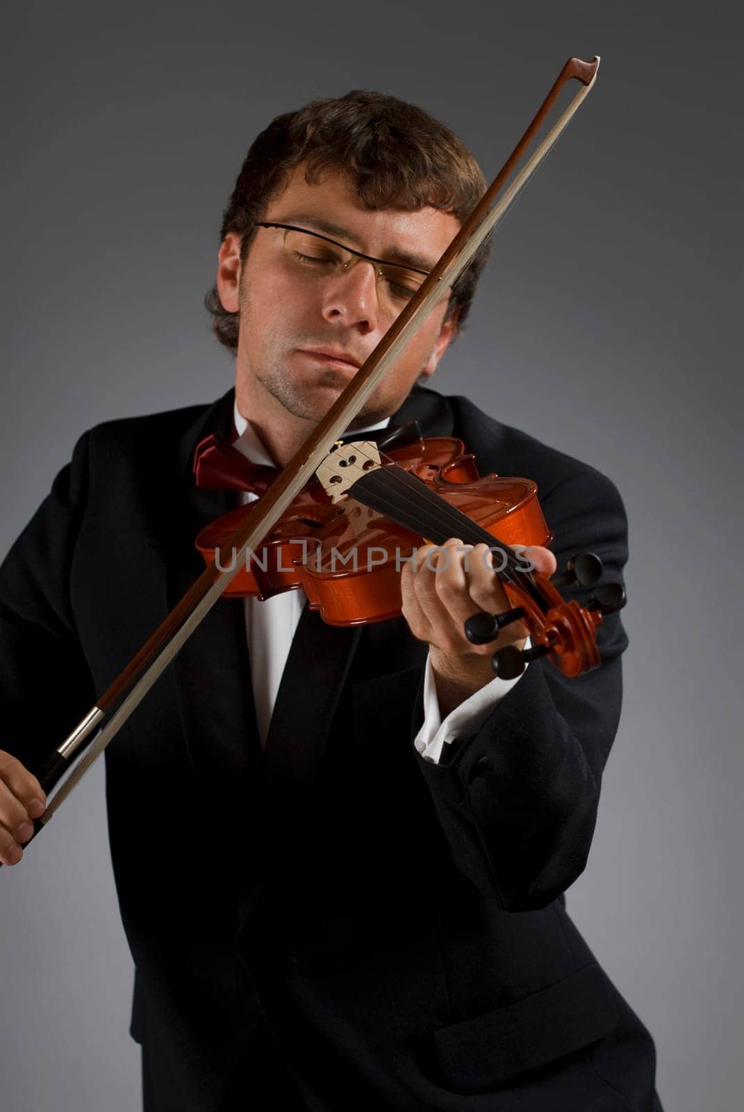Close-up of a male musician playing a violin