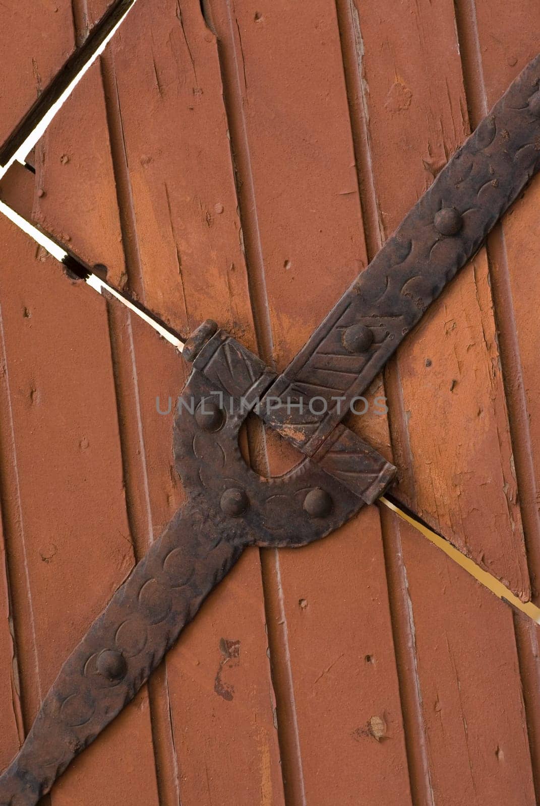 Close-up of a hinge on a closed door