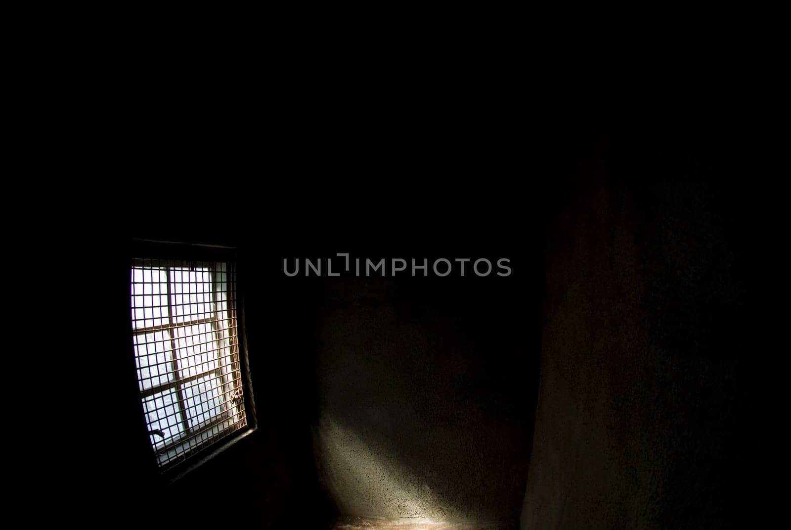 Sunlight entering a dark room through a window