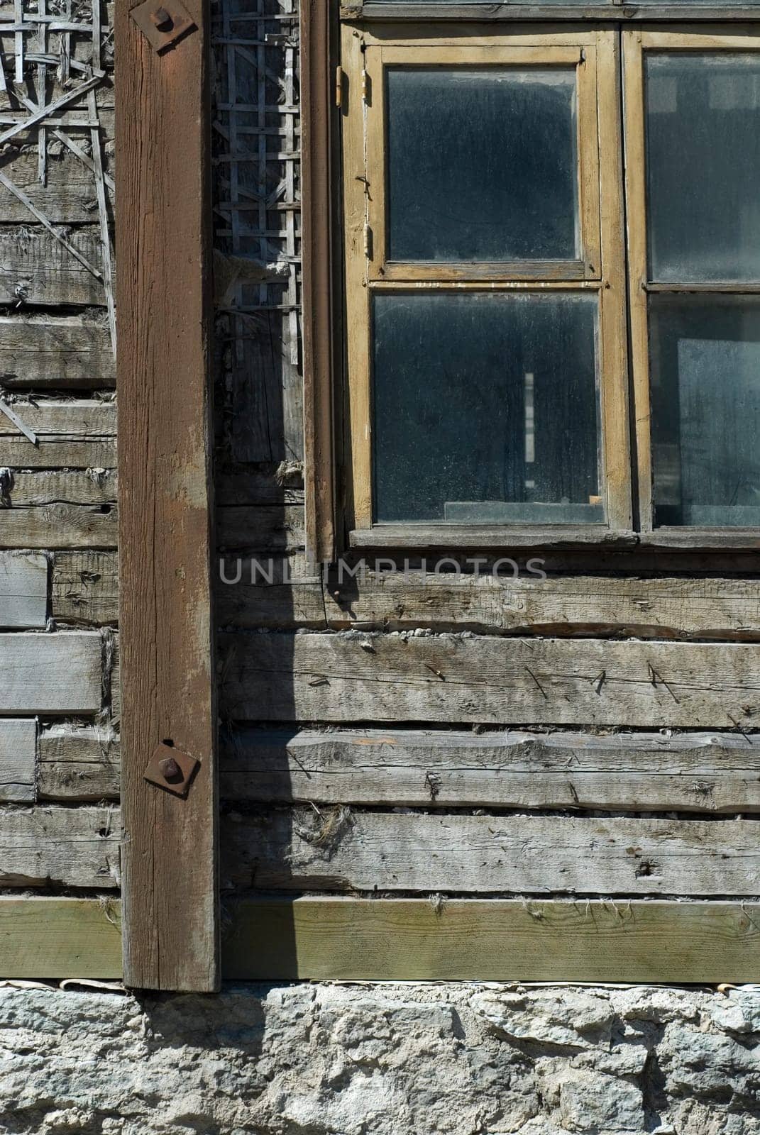 Close-up of a window on a wooden wall