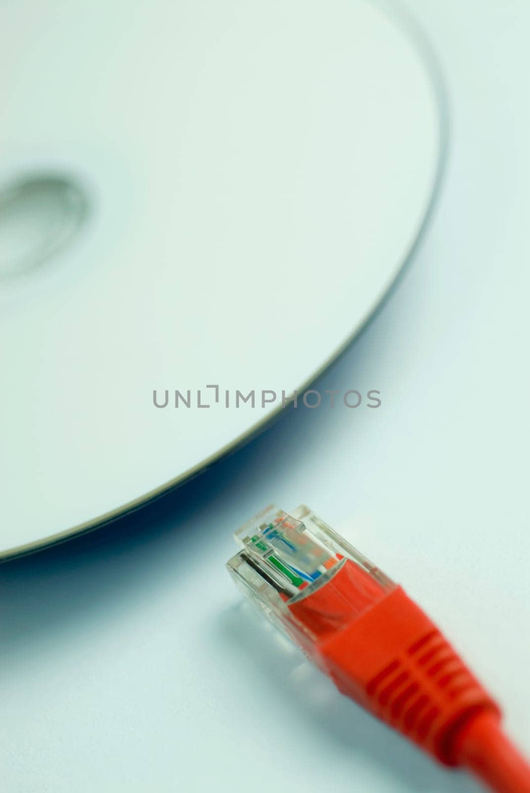 Close_up of a computer cable with a cd