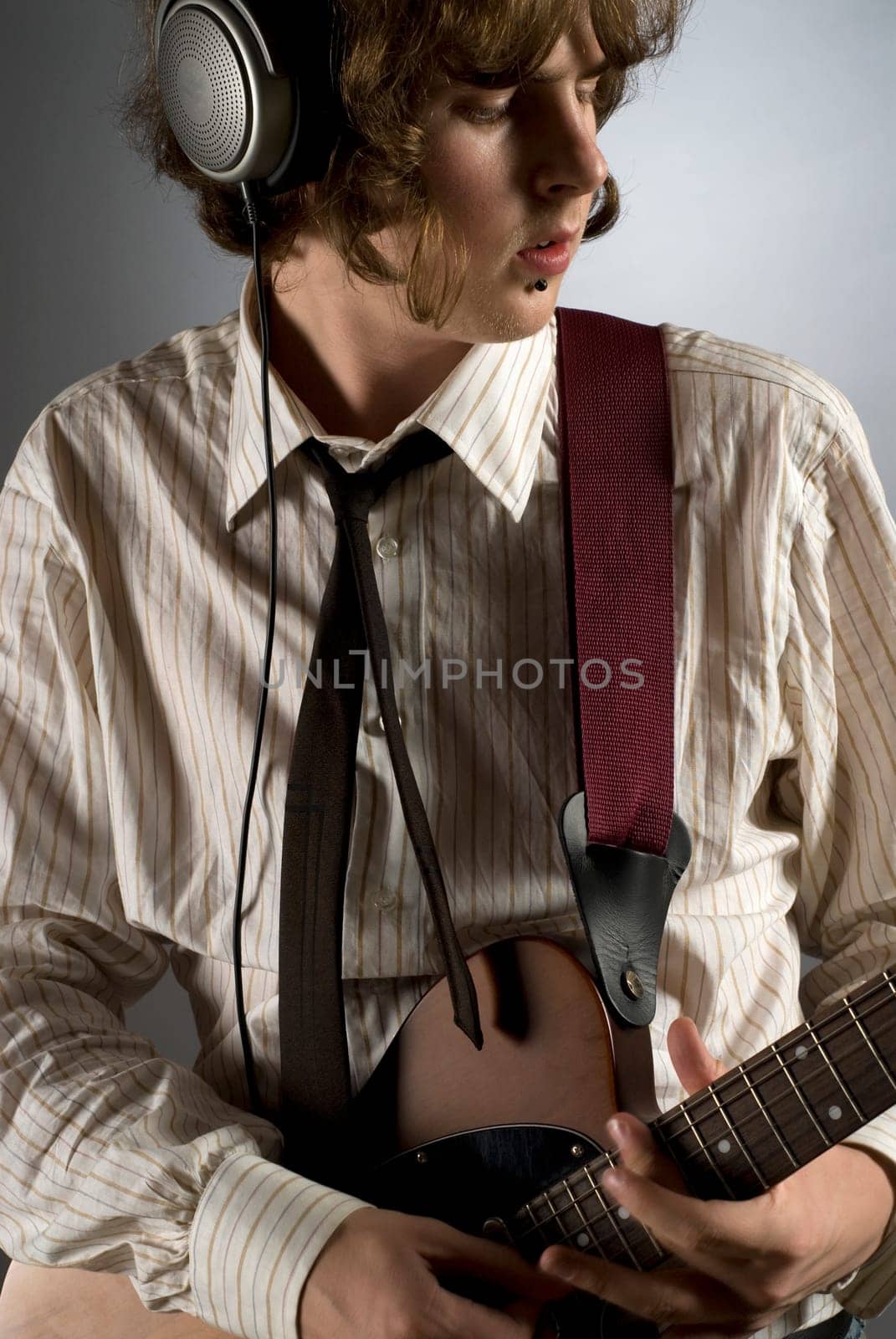 Close-up of a guitarist playing a guitar
