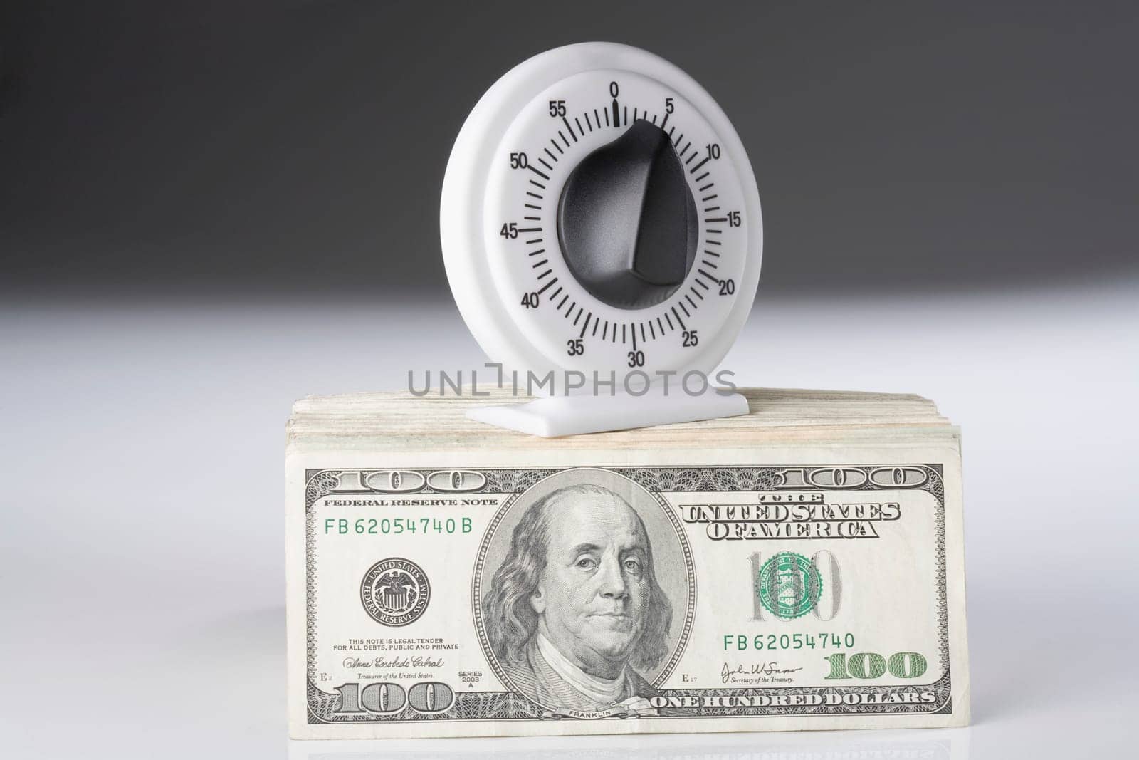 Close_up of a knob on a bundle of paper currency