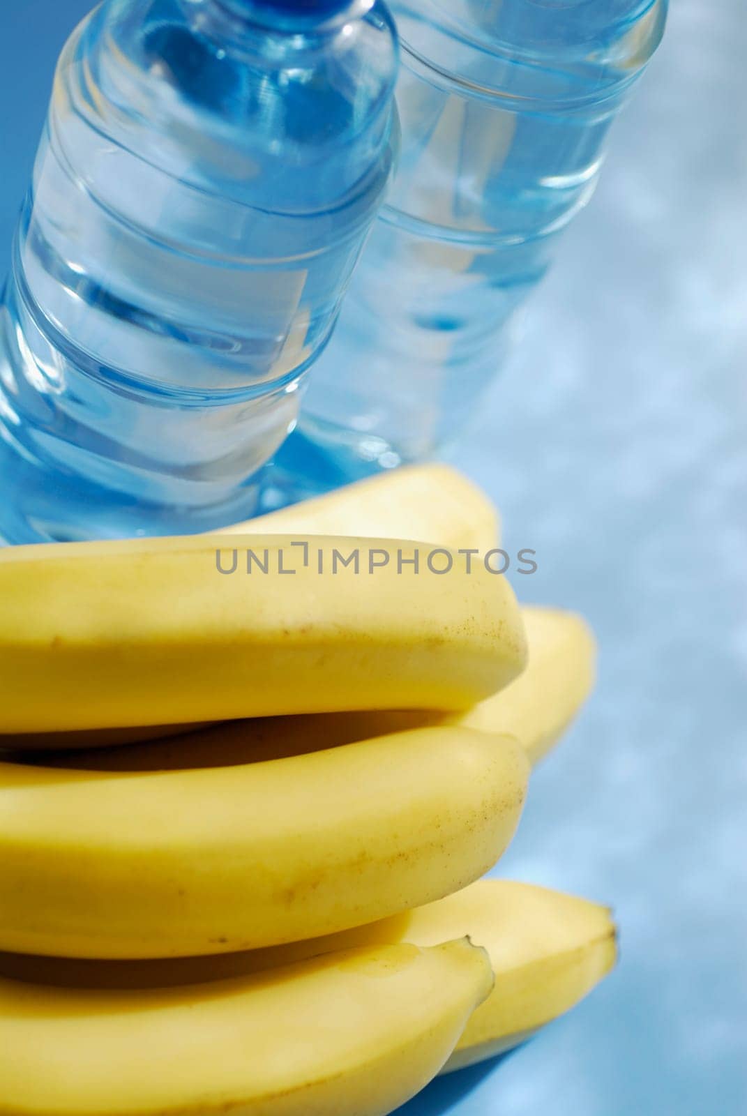 High angle view of bananas and two water bottles
