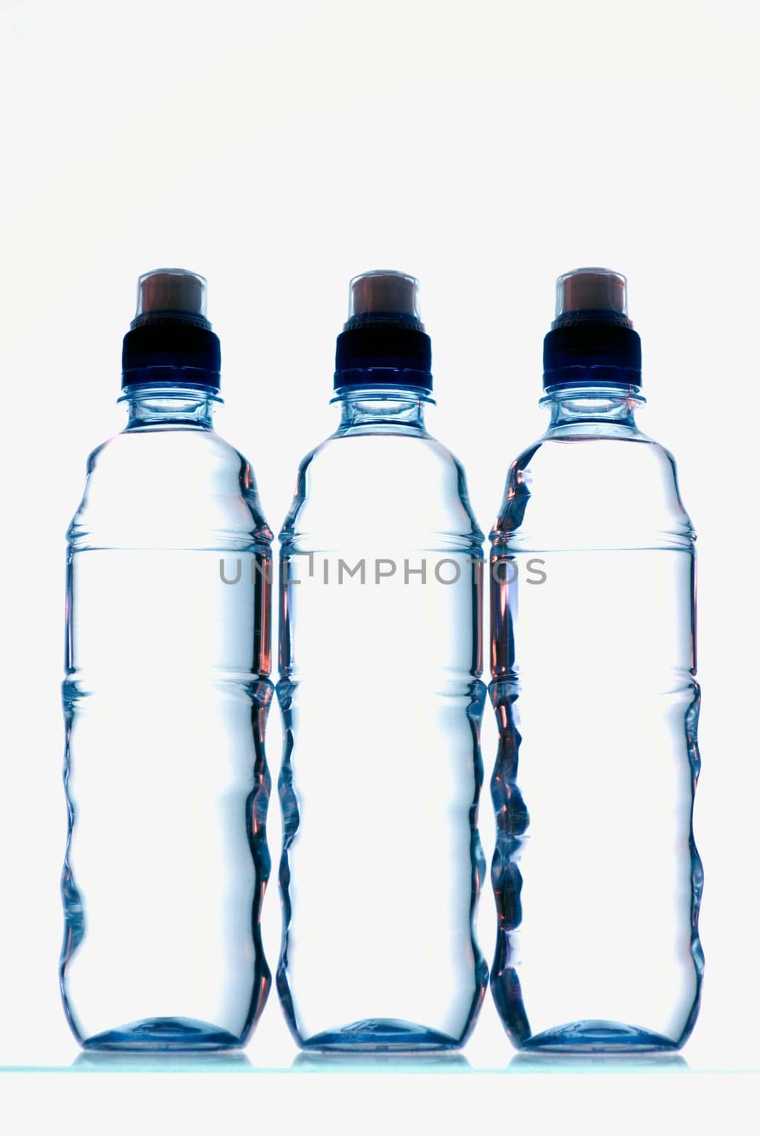 Close-up of three water bottles