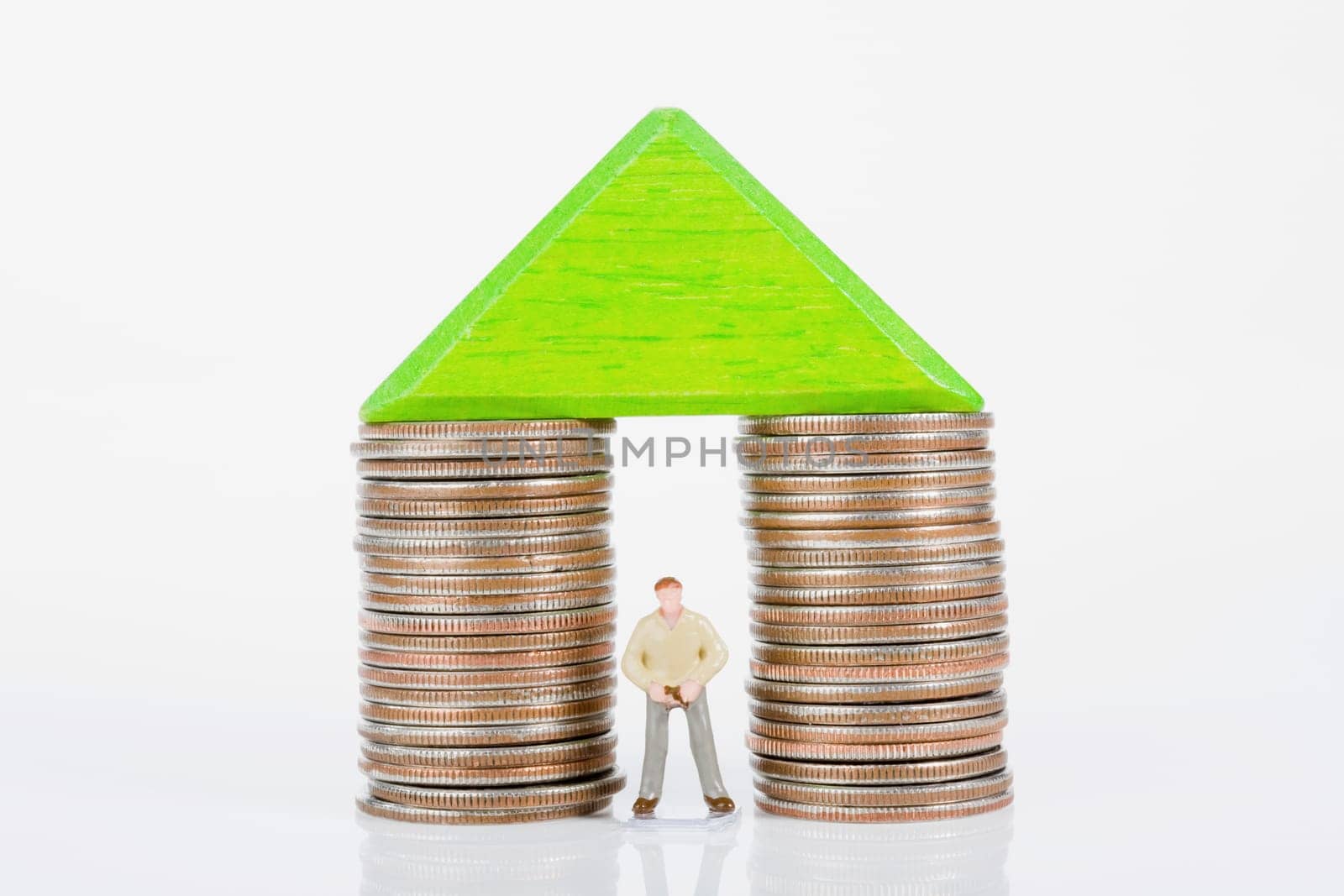Figurine between two stacks of coins