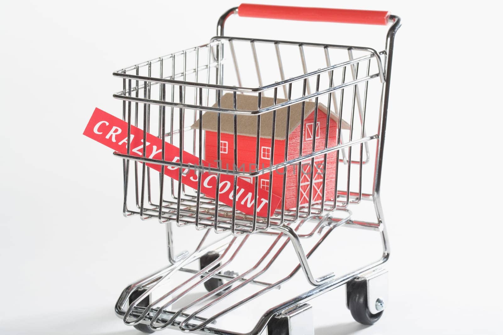 Close_up of a model home in a shopping cart
