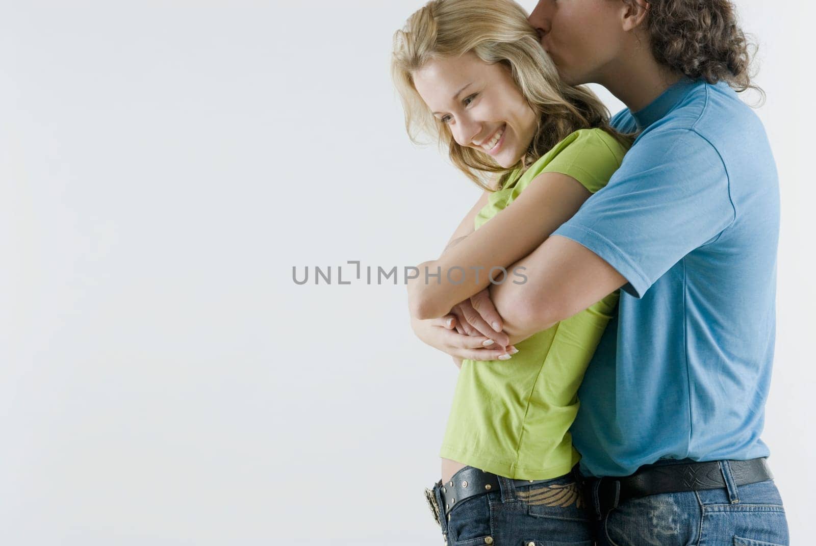 Side profile of a young couple romancing