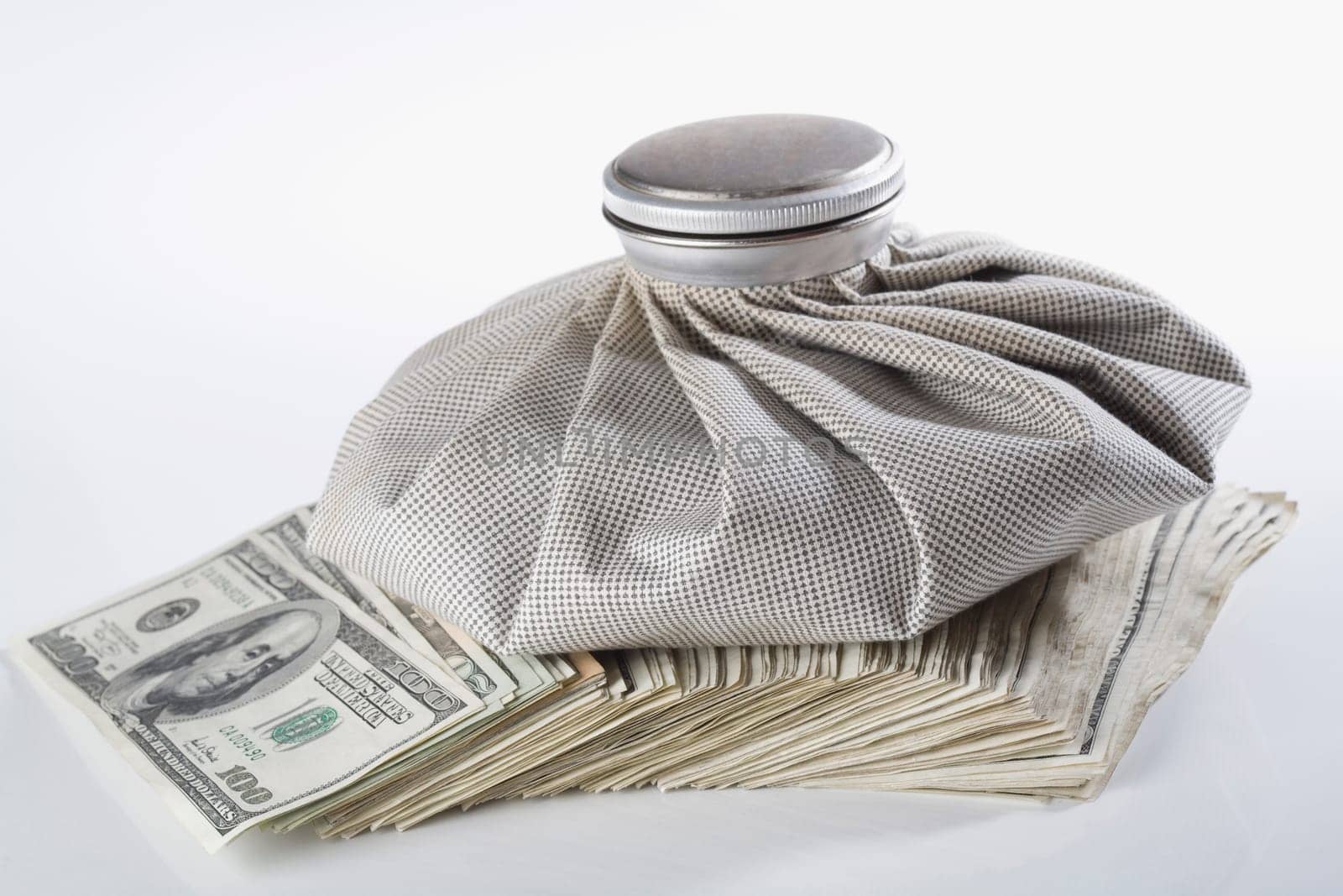 Close_up of an icebag on US paper currency