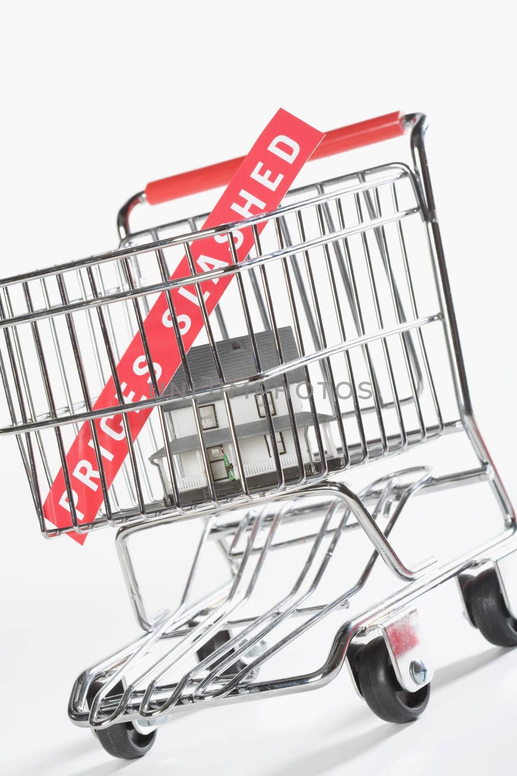 Close_up of a model home in a shopping cart