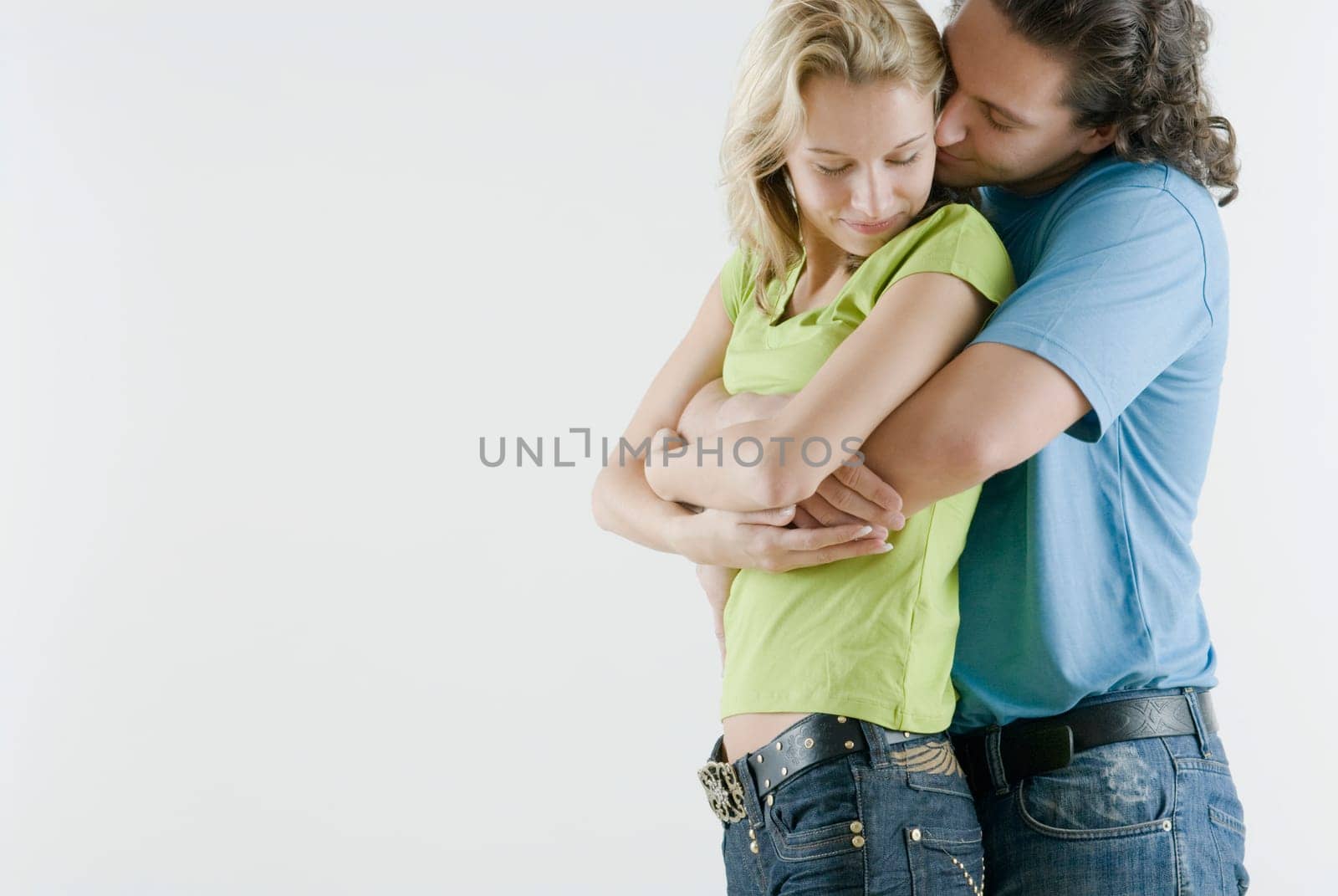 Side profile of a young couple romancing