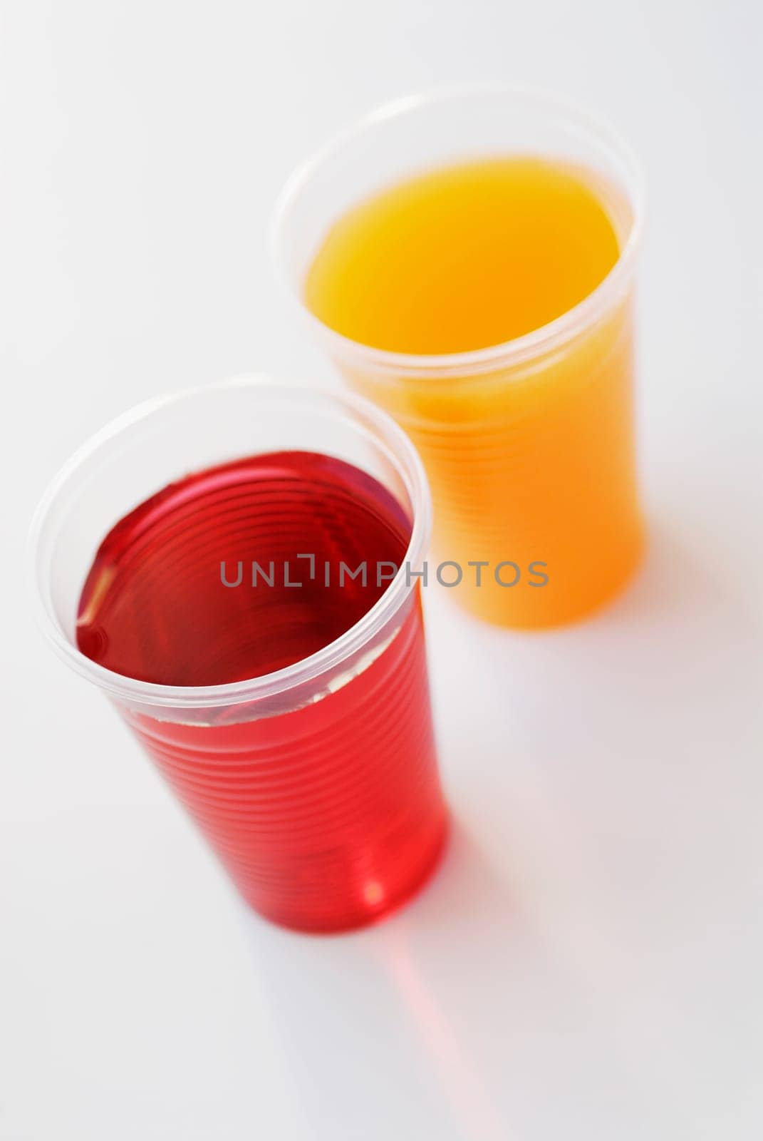High angle view of two glasses of juice