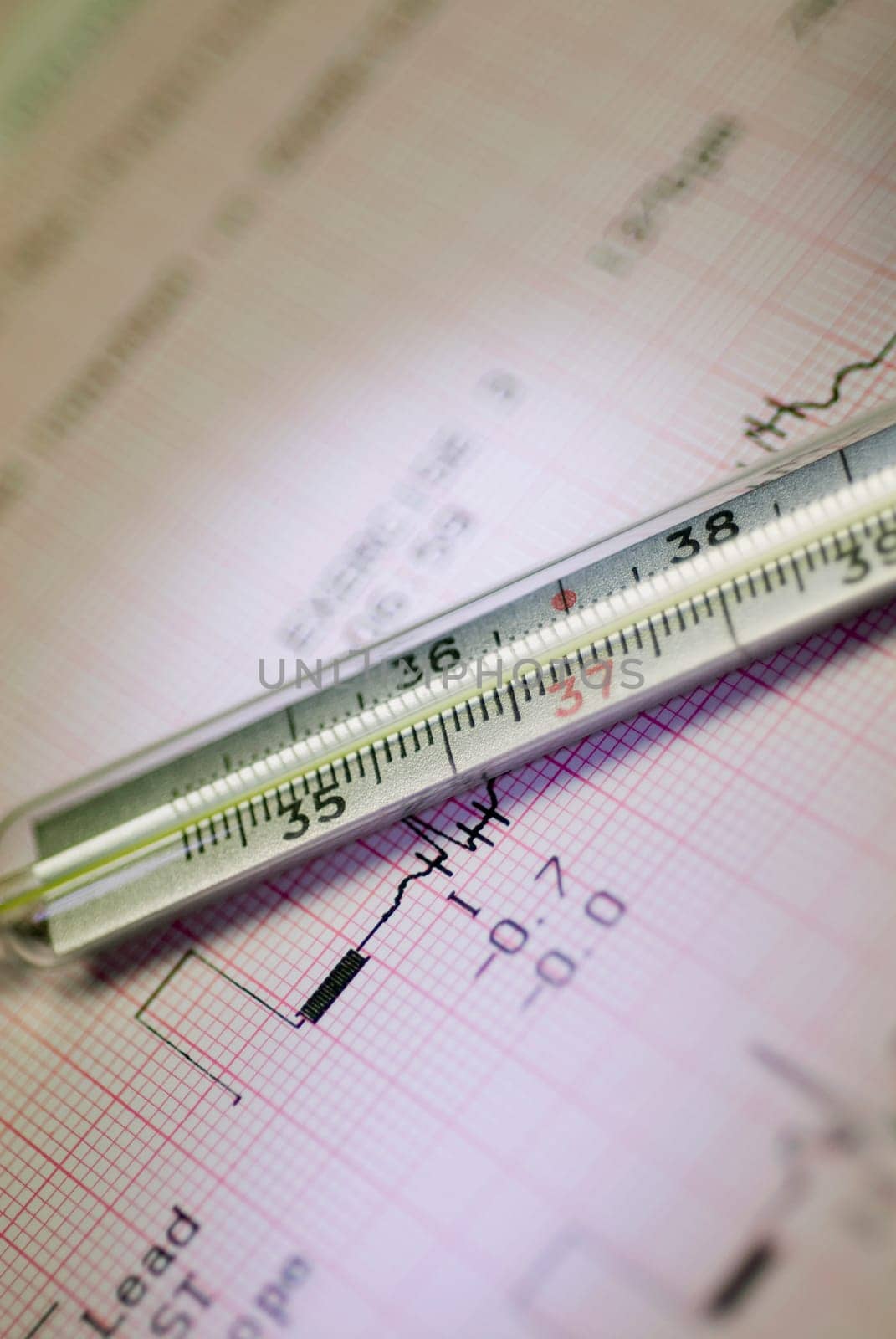 Close_up of a syringe on a medical report