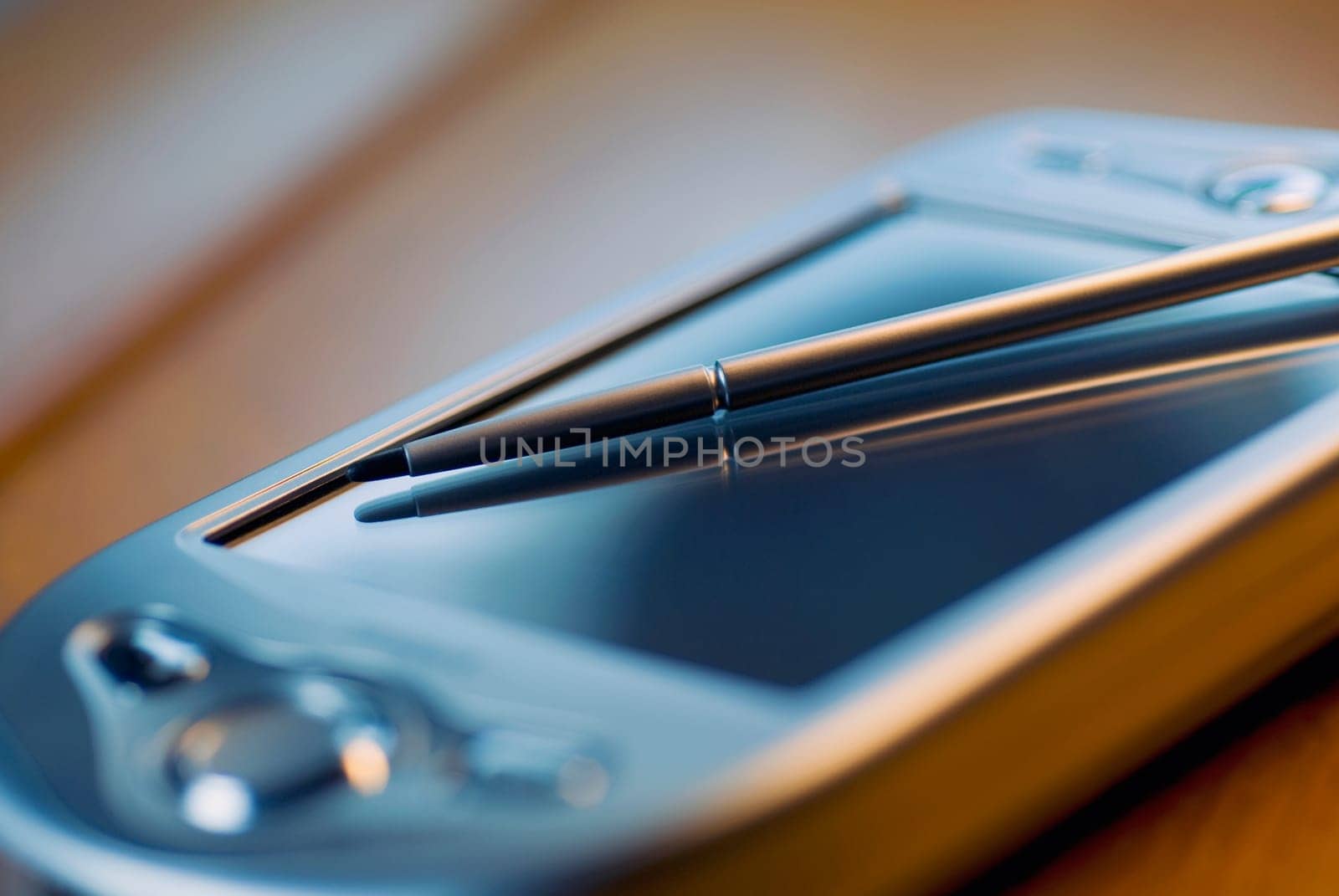 Close_up of a personal data assistant and a stylus