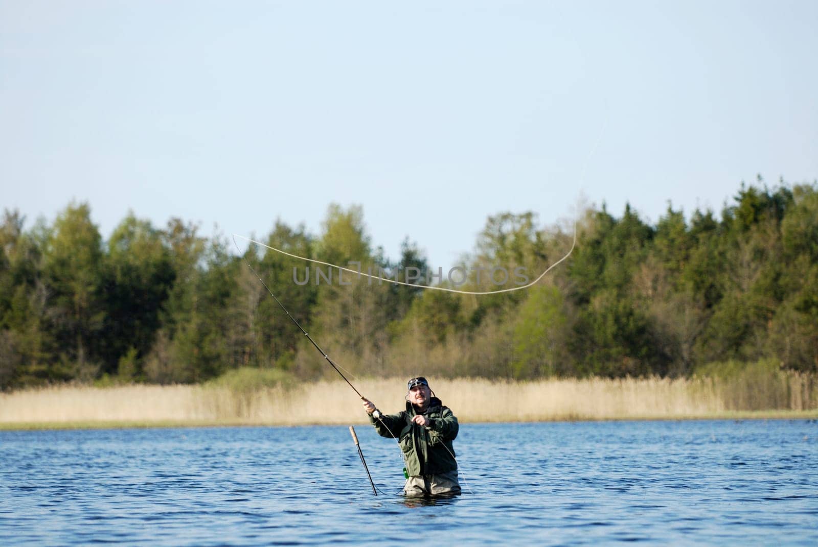 Mature man fishing in the river