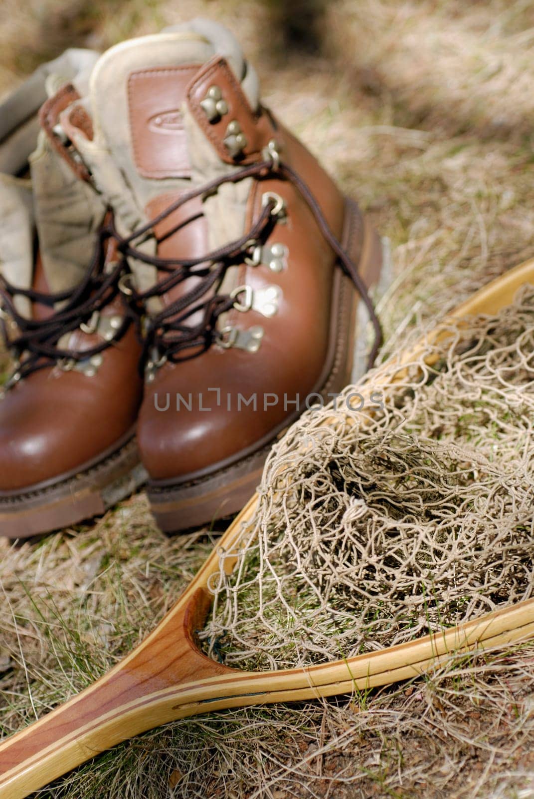 High angle view of a pair of shoes and a fishing net