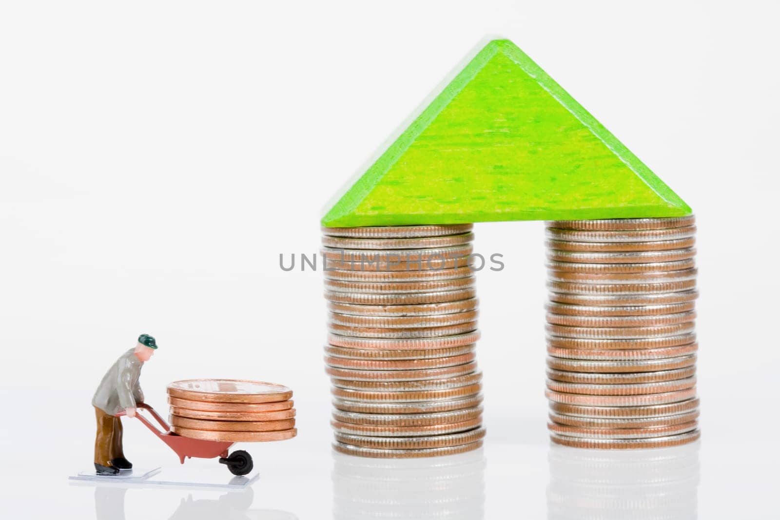 Figurine of a manual worker carrying coins on a wheelbarrow