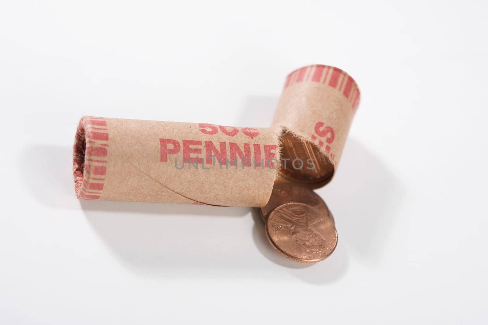 Close_up of a broken coin roll of pennies