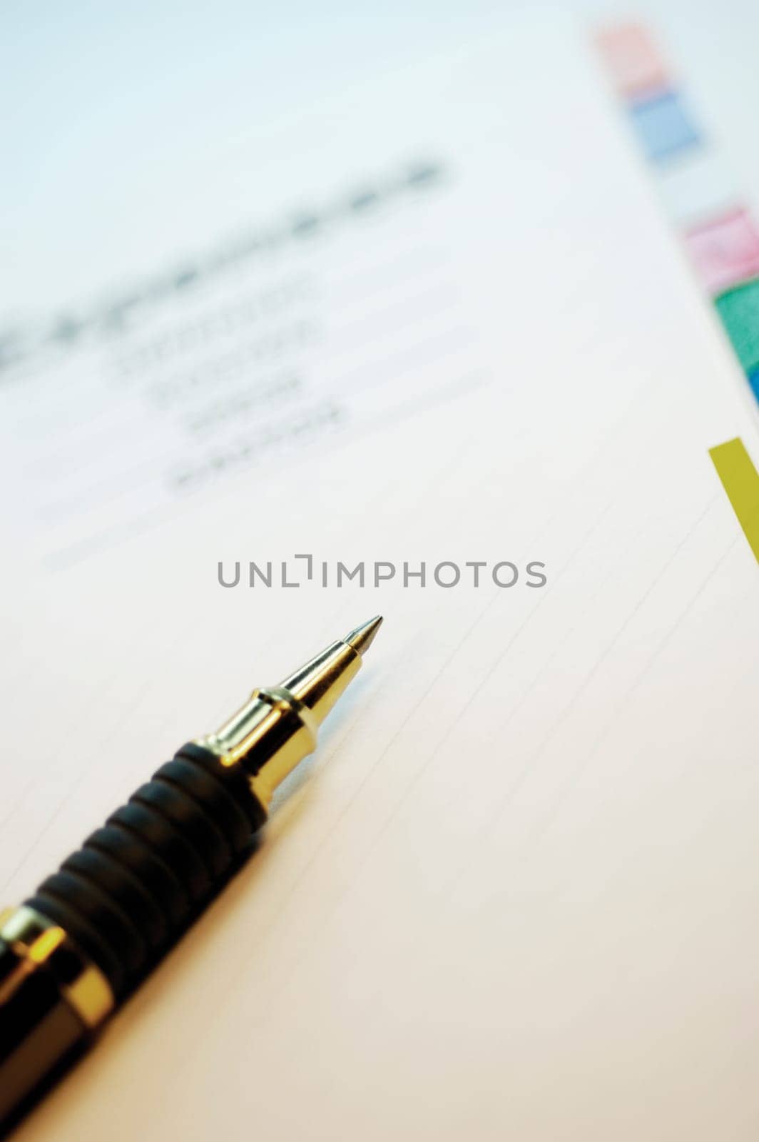 Close-up of a ballpoint pen on a personal organizer