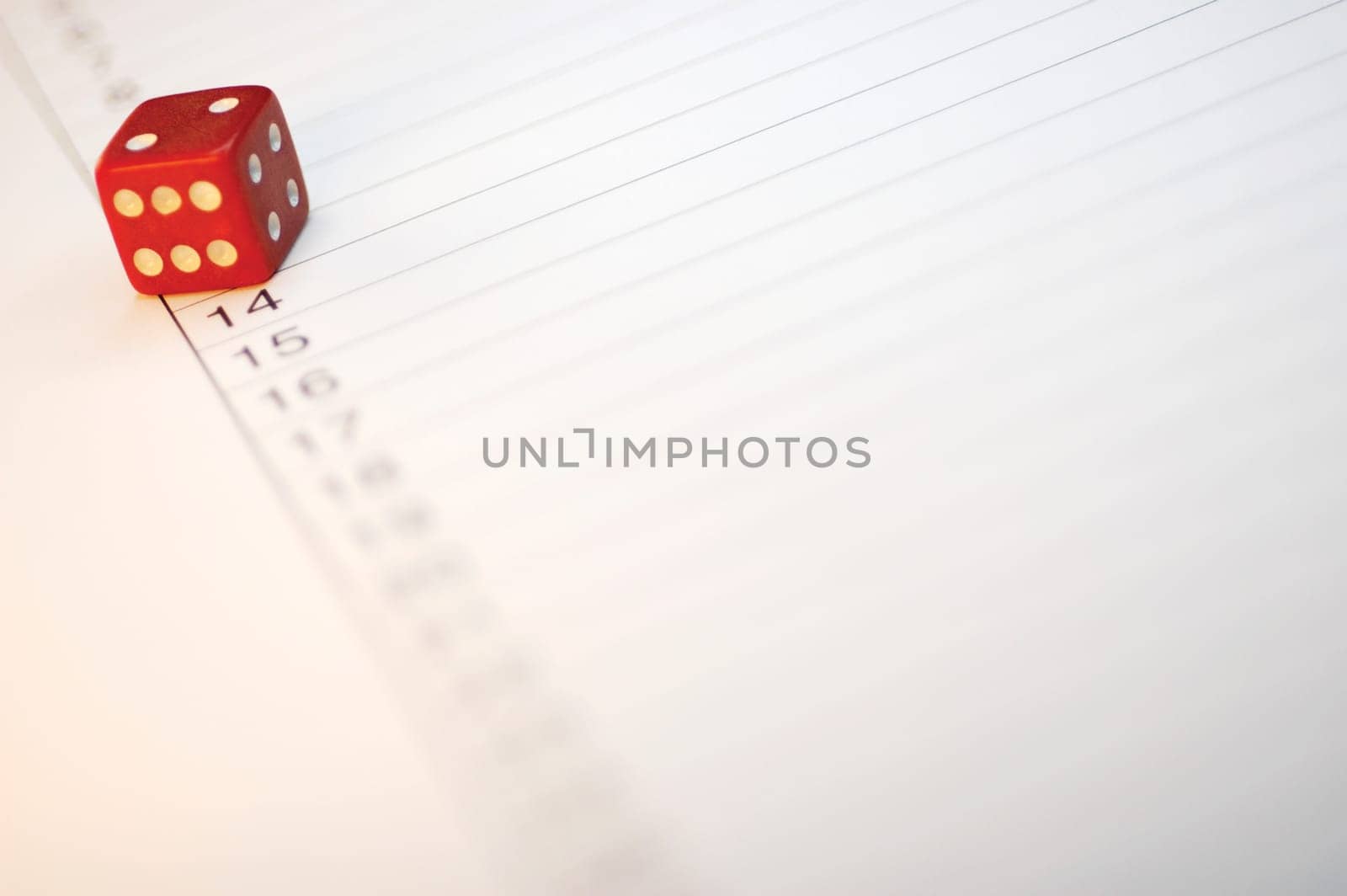 Close-up of a dice on paper