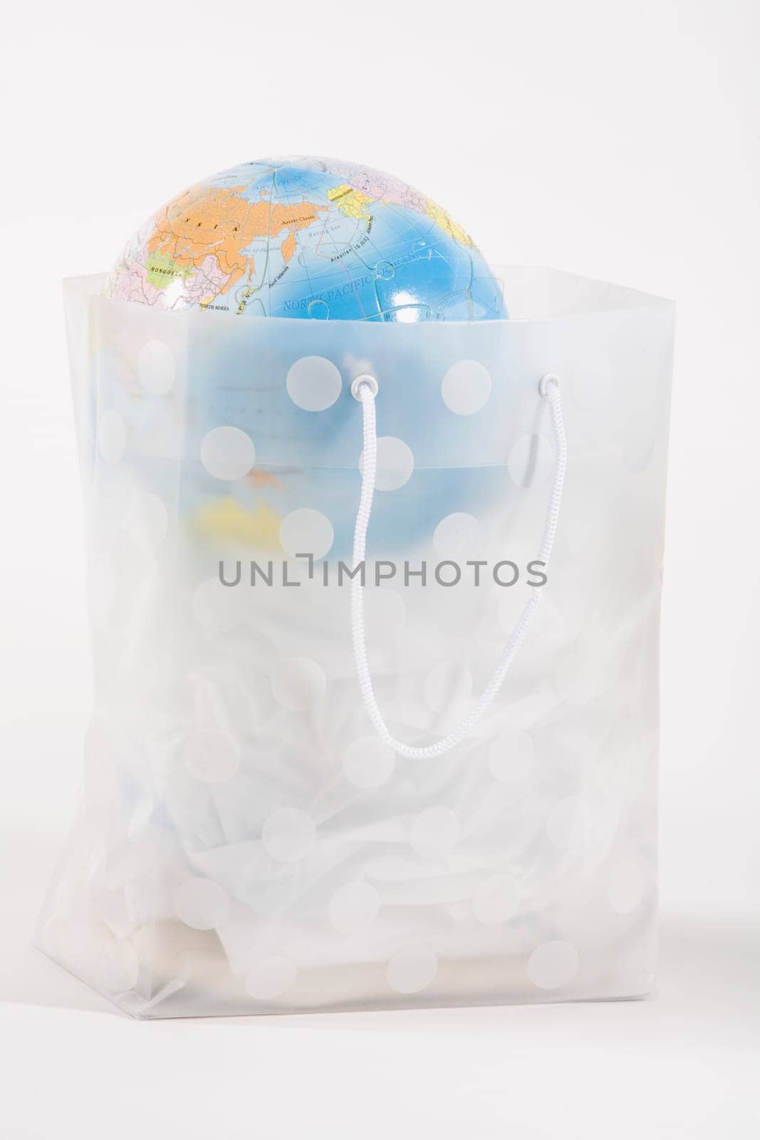 Globe in a transparent shopping bag
