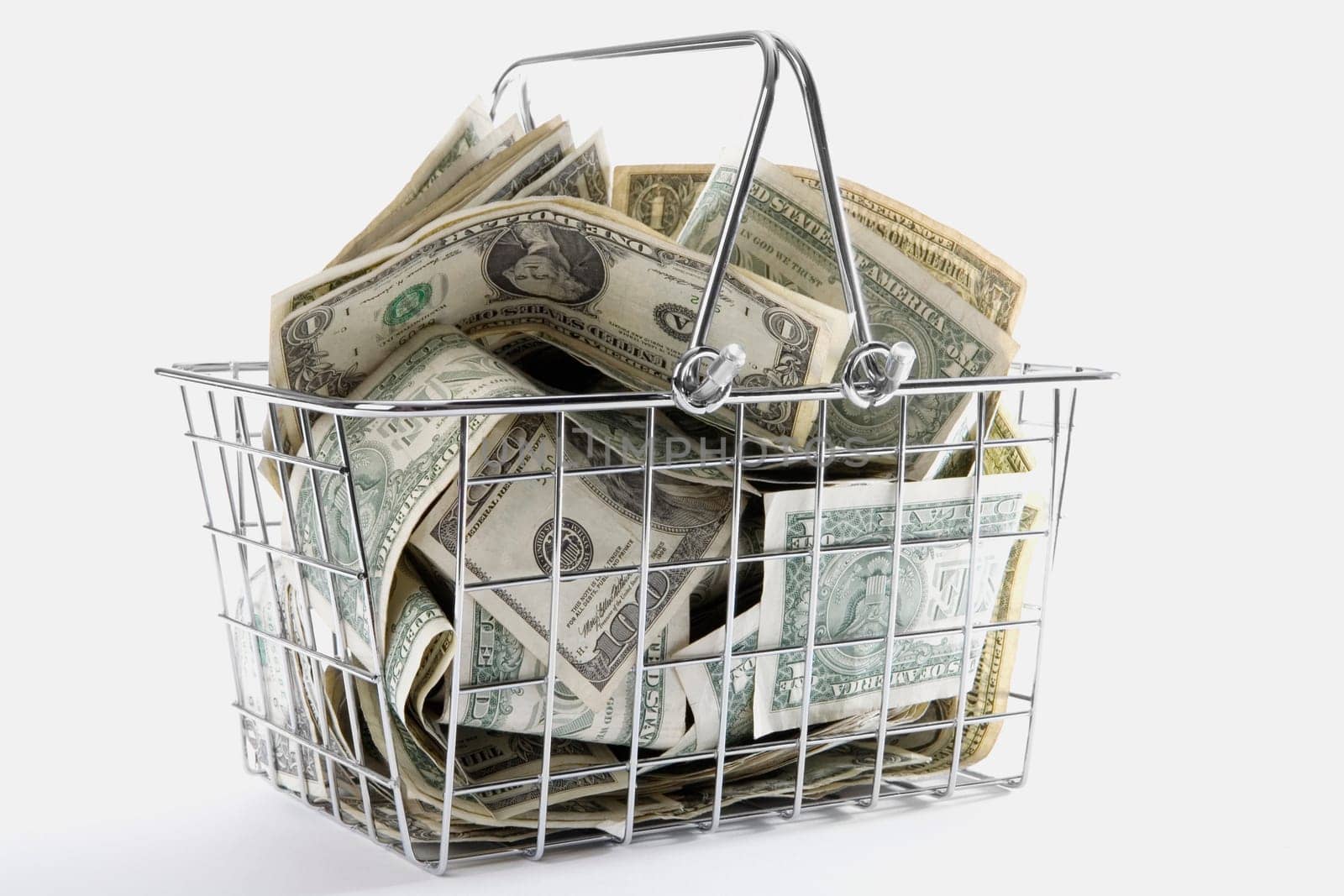 Close-up of American paper currency in a shopping basket