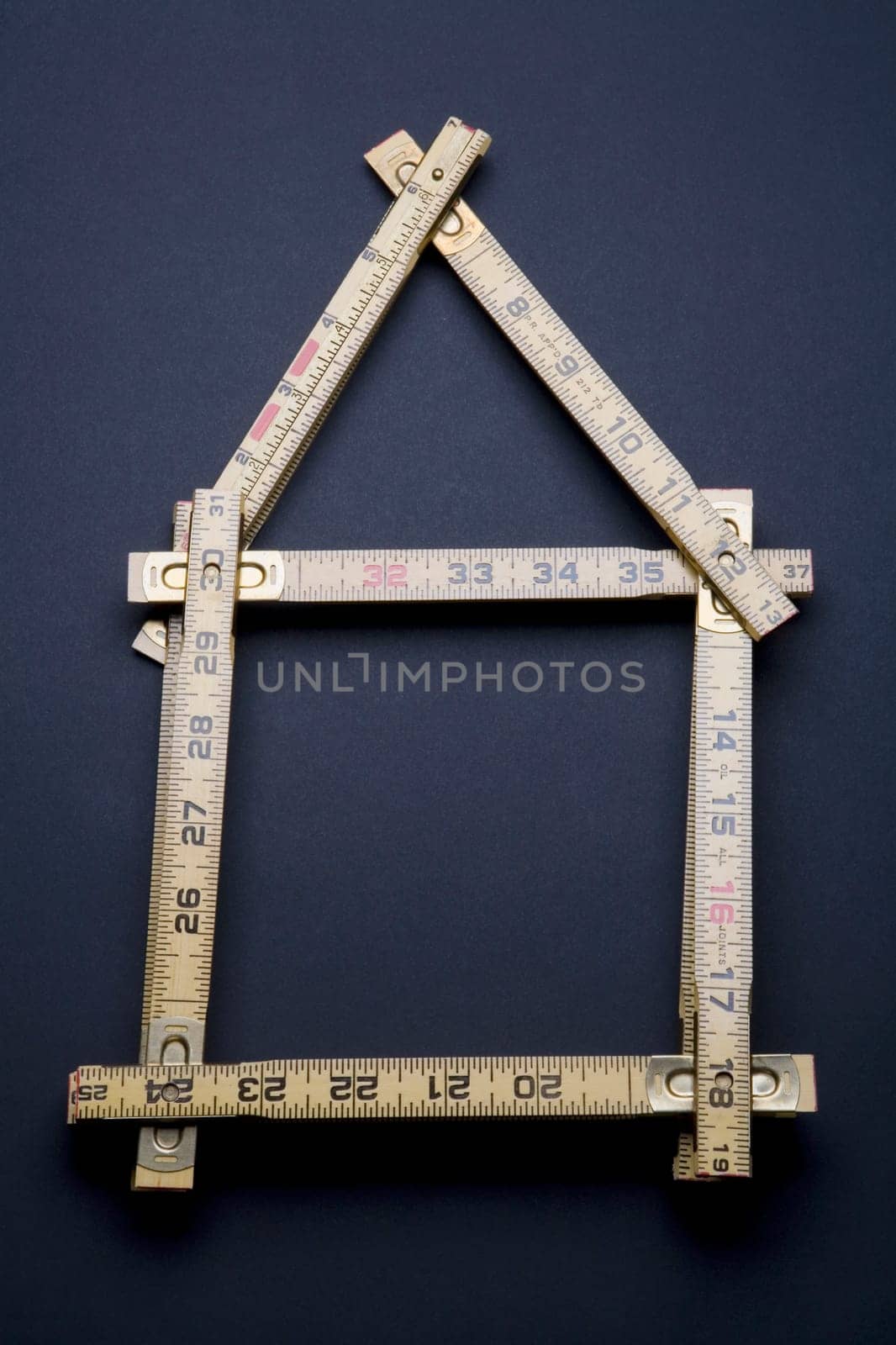 Close-up of a measuring scale in the shape of a house