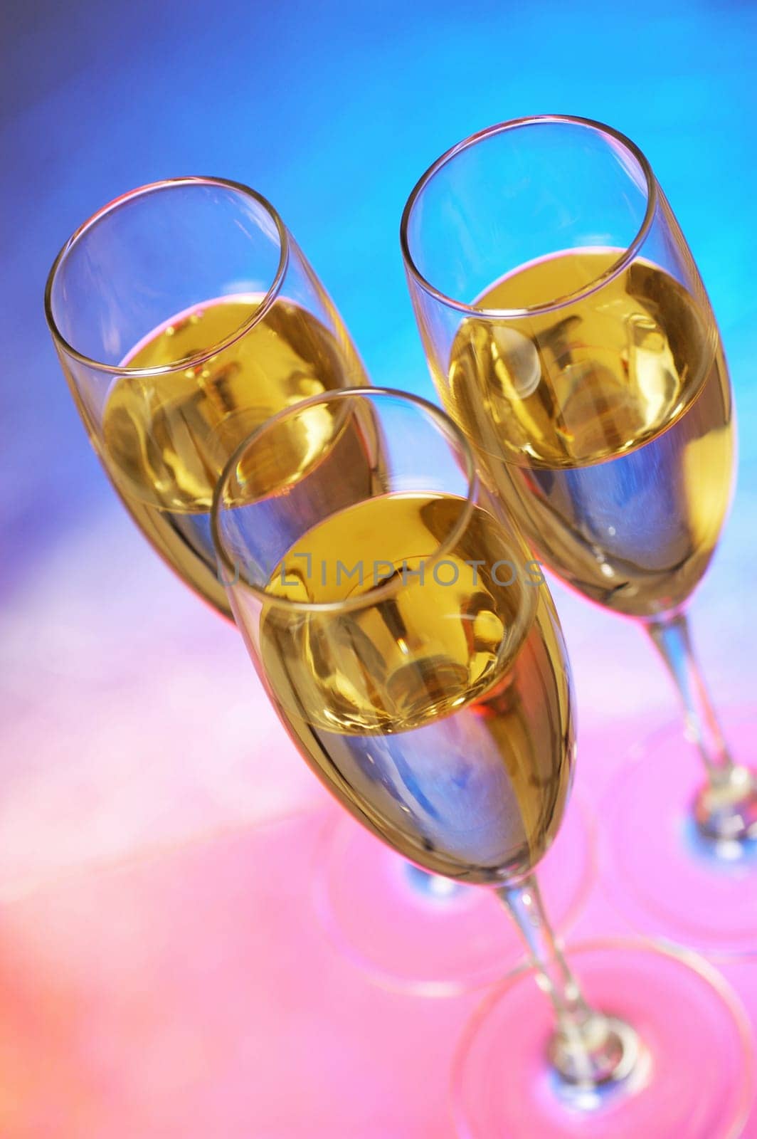 High angle view of champagne in three champagne flutes