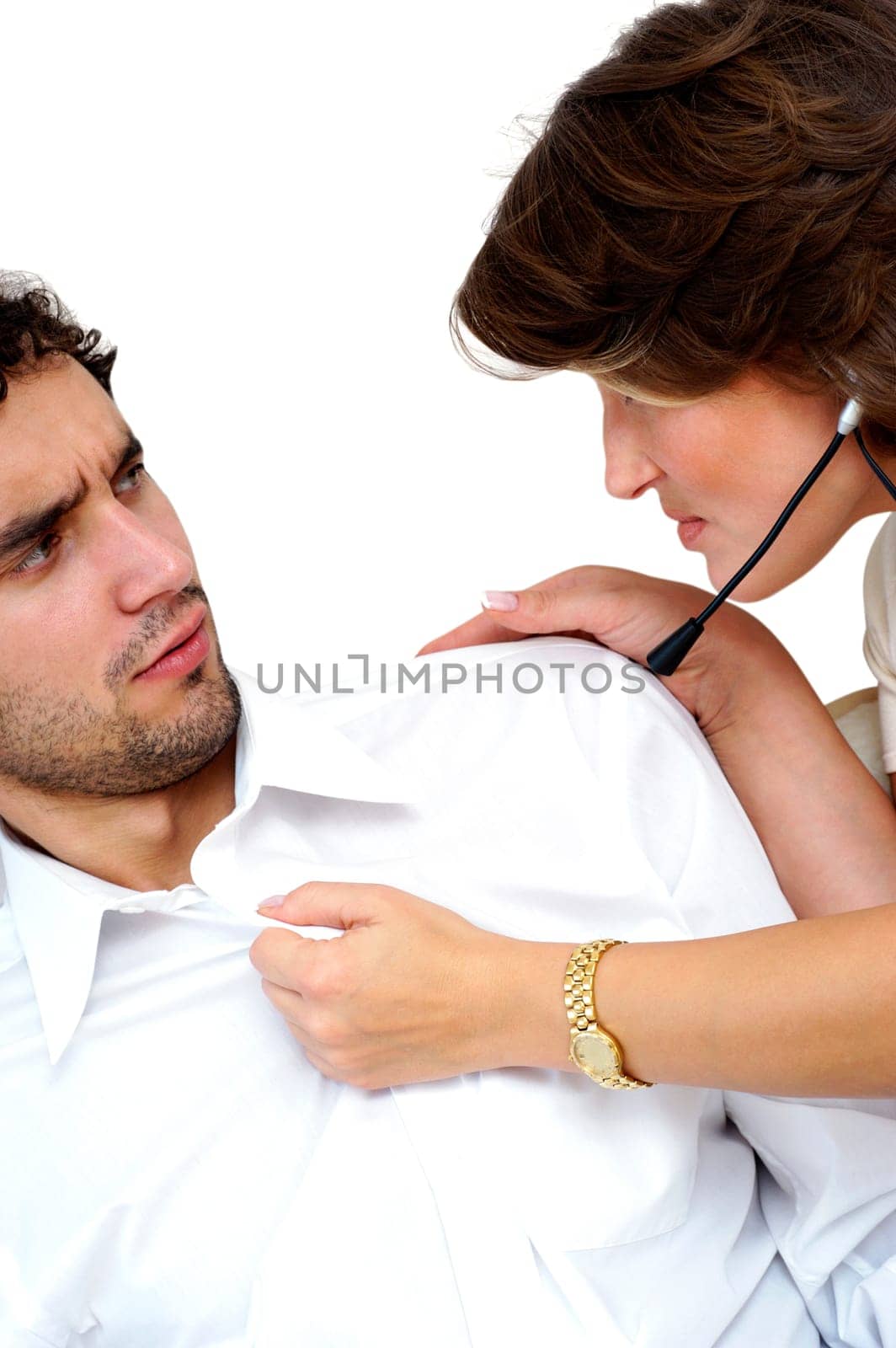 Close-up of a young woman pulling the shirt of a young man
