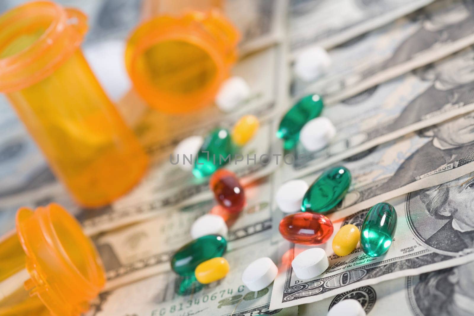 Close_up of medicines and pill bottles on US paper currency