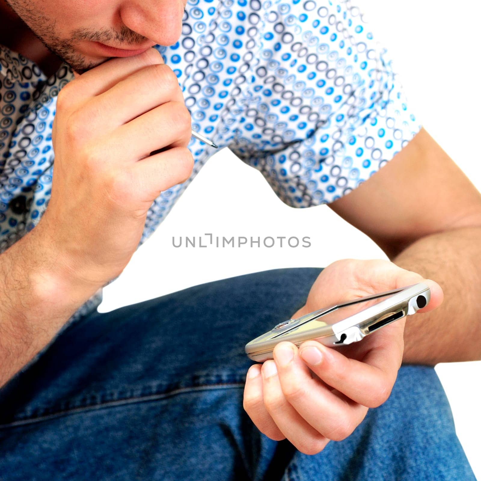 Close-up of a young man holding a personal data assistant