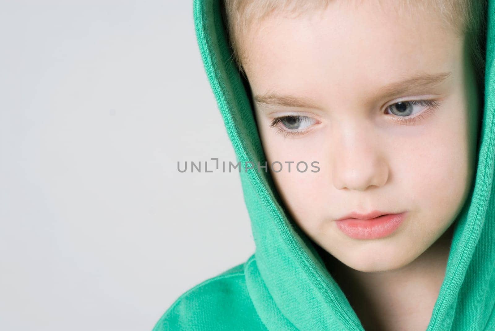 Close_up of a boy thinking