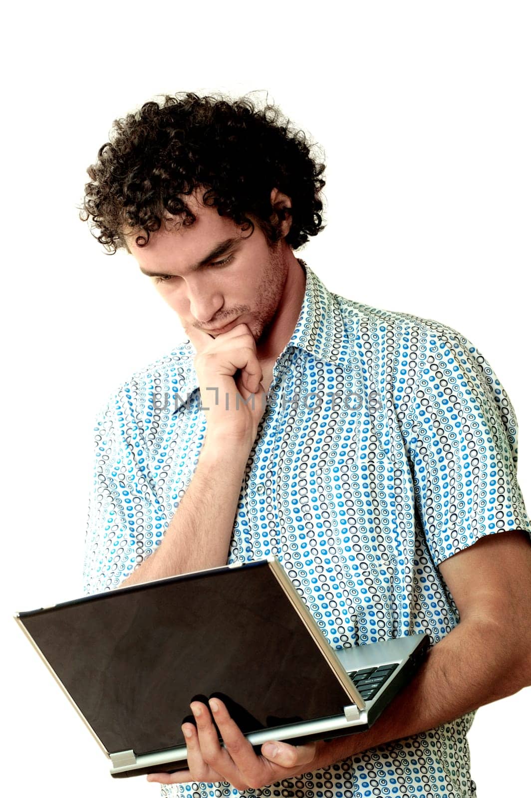 Close-up of a young man holding a laptop