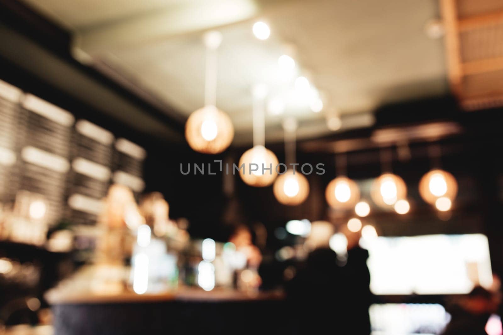 Blurred loft coffee shop with barista and customer. High quality photo