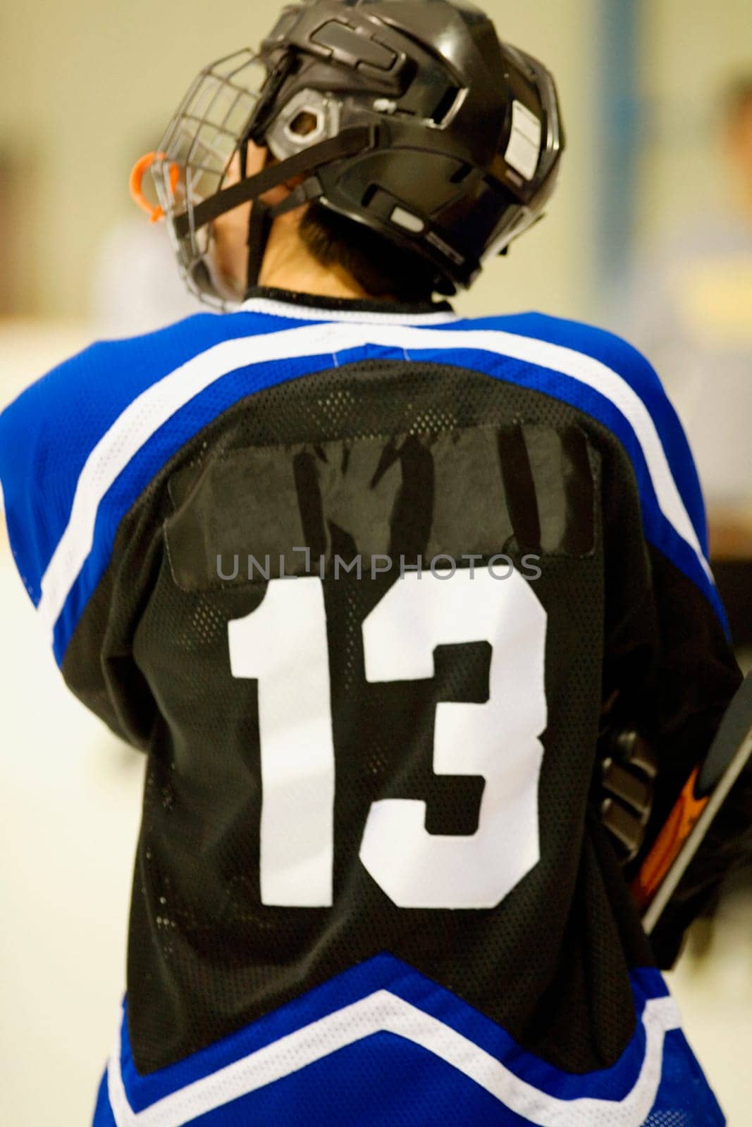 Rear view of an ice hockey player in a uniform